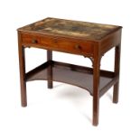 A George III mahogany writing table with inset leather top,