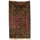 A Kashan silk rug, the floral field to multiple flowerhead borders,