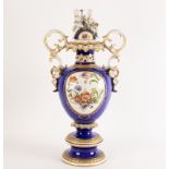 An Italian Capri Nove Capo di Monte style vase and cover of baluster form decorated panels flowers
