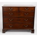 A George III mahogany chest of two short over three long drawers, on bracket feet,