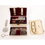 A quantity of costume jewellery including a white metal fringe necklace and a few miniature medals