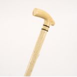 A whalebone walking stick with ivory handle Condition Report: This lot contains an