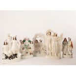 A Staffordshire group, musicians, 42cm high, another two highlanders with dog beside a tree,