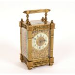 A gilt-brass eight-day carriage clock with pierced, chased and engraved surround, 16.