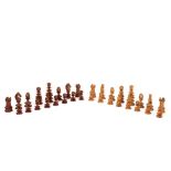 A turned wood chess set of bobbin form, the king 7cm high in a plush lined mahogany box, 25.