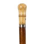 A Queen Anne walking stick, the ivory handle with pique work decoration,
