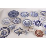 A quantity of tea wares to include a teacup and saucer in the Chinese Tea Table pattern,