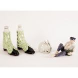 A pair of Continental boot warmers with green scrolled decoration, 17cm high,