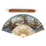An 18th Century English fan painted with scenes of a courting couple in a landscape,