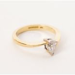 A pear-shaped diamond solitaire ring set in 18ct yellow gold,