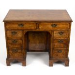 An 18th Century style walnut kneehole desk, with herringbone banding, 92.