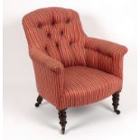 A Regency rosewood framed tub armchair on turned front legs with castors Condition
