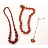 A single row of cherry amber beads, the graduated oval beads to a barrel clasp,