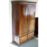 A late Georgian mahogany wardrobe on two-drawer base with bracket feet,