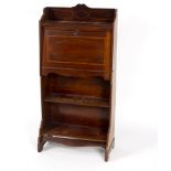 An Edwardian mahogany escritoire, the fall front above shelves and inlaid,