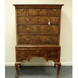 An early 18th Century walnut chest on stand, herringbone banding,