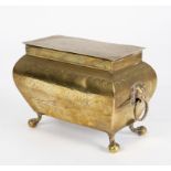 An 18th Century brass tobacco box of sarcophagus form with lion head ring turned handles,