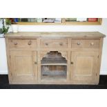 A Victorian pine dresser fitted drawers and cupboards around a central recess, 183.