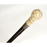 An simulated rosewood walking stick with embossed silver collar and ivory handle carved acanthus