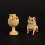 A 19th Century Japanese carved ivory netsuke depicting a rabbit in a pedestal cup, signed, 4.