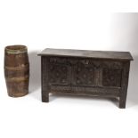A 17th Century triple-panel carved oak coffer (alterations) and a coopered stick stand,
