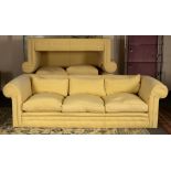 A three-seater sofa with button divan base,