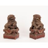 A pair of Chinese carved and gilded Dogs of Fo,