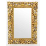 A Florentine gilt frame, later mirror plate,