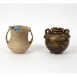 A Qijia culture earthenware jar of plain twin-handled form, 10.