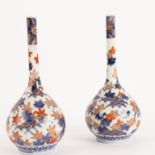 A pair of Japanese Imari bottle vases