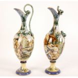 A pair of Cantagalli style maiolica ewers with entwined handles,