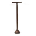 A 19th century mahogany torchère with fluted column on turned base,