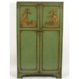 A 1930s green Chinoiserie cupboard, decorated figures and pavilions,