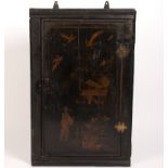 An early 19th century chinoiserie corner cupboard,