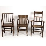 Three open armchairs