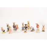 A collection of twelve Royal Doulton Bunnykins figures, including Dollie Bunnykins,