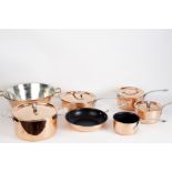 Seven copper pans