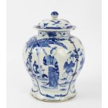 A Kangxi blue and white pear shaped vase and cover decorated Long Elizas and Wha Wha in garden
