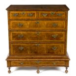 A George II walnut chest with herringbone banding,