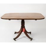 A mid 19th Century mahogany rectangular breakfast table on a turned column and quadruple support,