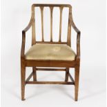 A George III mahogany elbow chair with slatted back