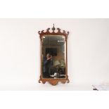 A George III mahogany fret carved wall mirror,