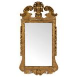 A gilt gesso framed mirror of 18th Century design, the plate 78.