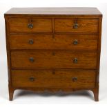 An early 19th Century mahogany and crossbanded chest of two short over three long drawers on