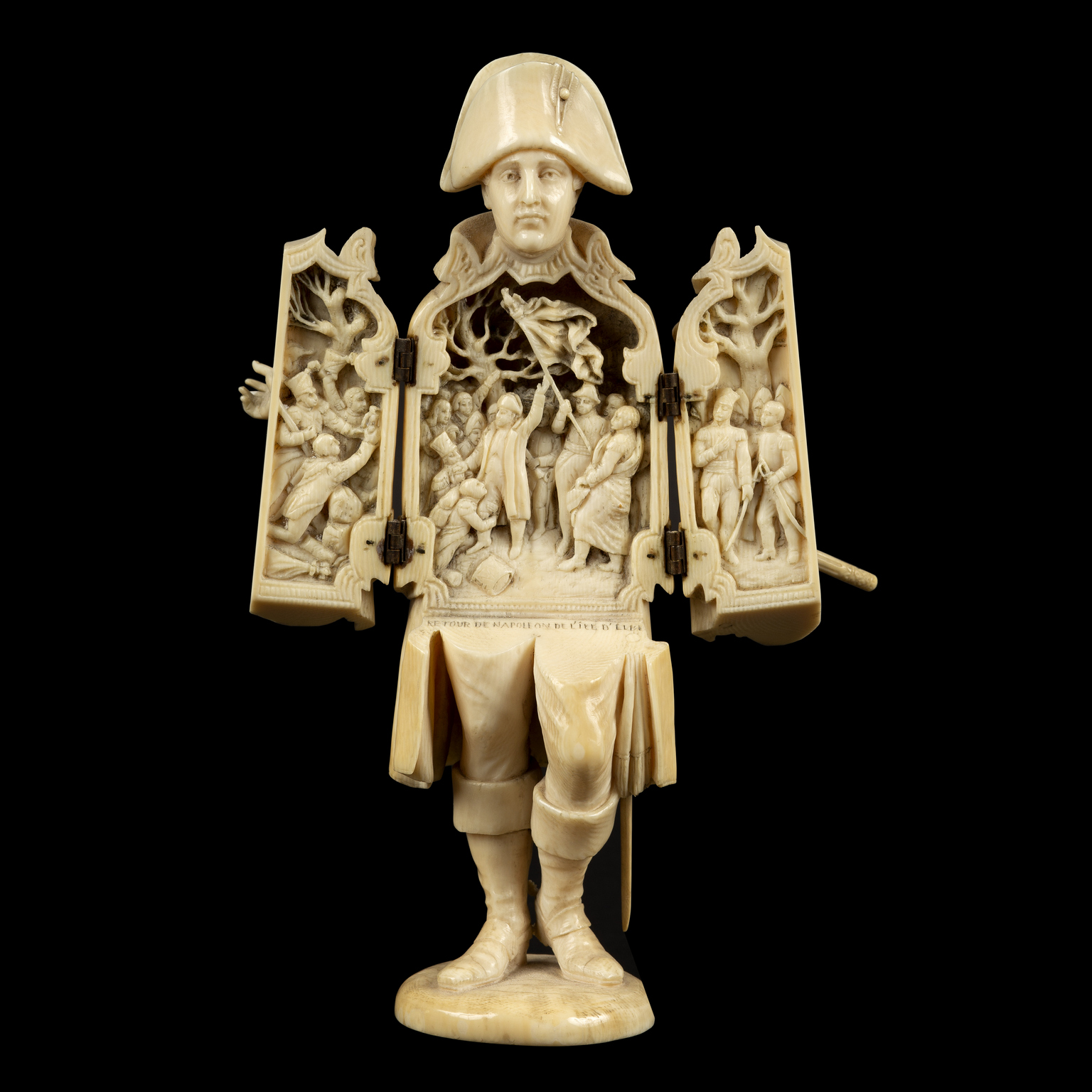 A Dieppe carved ivory figure of Napoleon, inscribed 'Retour de Napoleon de Lile d'Elbe',