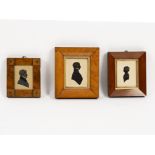 Three 19th Century silhouette portraits with gilt highlights/one with inscription verso/the largest