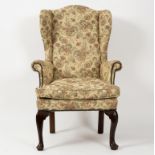 An early 19th Century wing back chair,