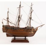 A three-masted man o' war fully rigged and with cannon boarding boats etc.