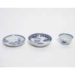 A Chinese blue and white tea bowl and saucer, Nanking Cargo, decorated pavilions, the saucer 11.