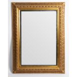 A large gilt-framed mirror